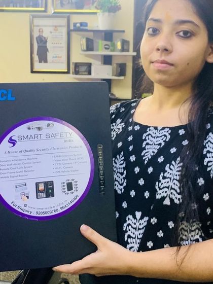 One of our team members holding a CCL EPABX unit, ready for dispatch. We supply quality security and communication products for our clients.