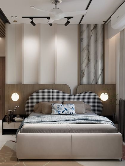 This bedroom design features a unique headboard with a houndstooth pattern, set against a feature wall with a mix of marble and wood textures. The track lighting and pendant lamps provide versatile lighting options.