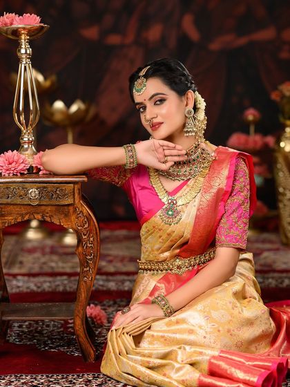 A confident and poised bridal portrait. The makeup enhances her features beautifully, creating a look that is both strong and feminine.