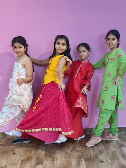 Posing for a group photo after their performance. The studio helps create lasting memories for the children.