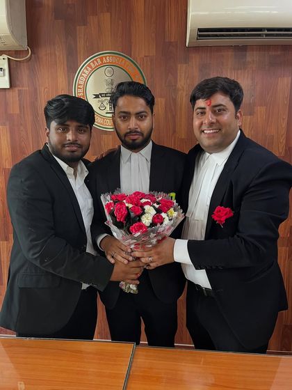 Presenting a bouquet to a colleague to celebrate a milestone.