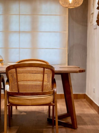A live-edge dining set in a client's home. The natural beauty of the wood, with its distinctive flowing edges and unique grain, adds rustic charm to the space.
