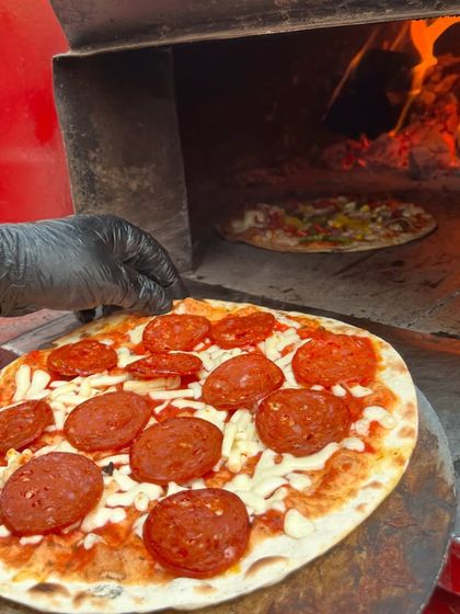 There's nothing like the sight of a fresh pepperoni pizza heading into a fiery wood-fired oven. This is the kind of live-action cooking we bring to your events.