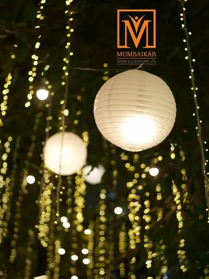 Creating a magical atmosphere with lighting. Hanging paper lanterns and strings of fairy lights in the trees can transform an outdoor space into a dreamy, romantic setting for a reception.