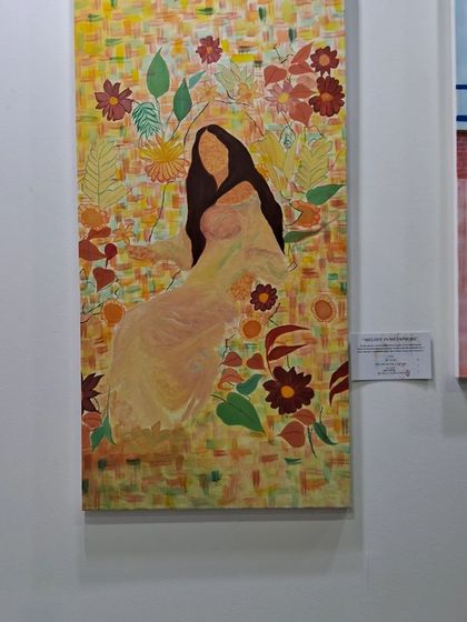 A woman surrounded by a warm, floral pattern, another beautiful artwork from Sinal Bajaj's collection at World Art Dubai.