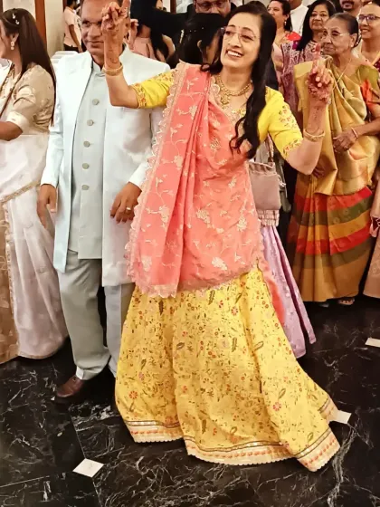 A guest enjoying the music and dancing at an engagement party. Creating an atmosphere where everyone feels the joy is my primary goal.