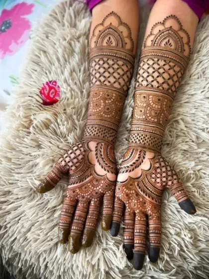 A full-coverage design on a fluffy rug, showing the contrast and detail. The pattern is intricate and covers the entire hand and arm.