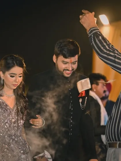 Another angle of the couple's grand entrance, capturing the reactions of family and friends around them.