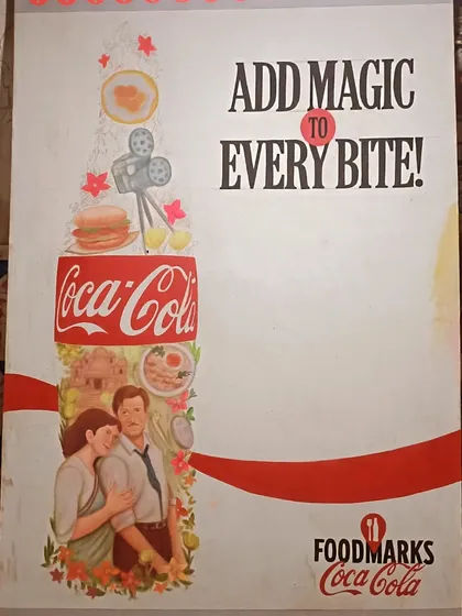 A poster for Coca-Cola's 'Add Magic to Every Bite' campaign, featuring a hand-painted illustration of a couple.