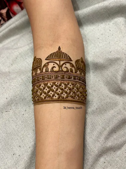 Another view of the doli arm band, showing the intricate dot work and shading.