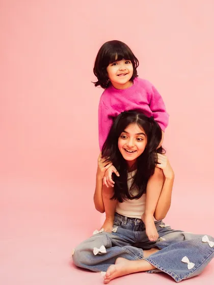 A playful moment captured forever. This photo perfectly shows the fun and loving relationship between them.