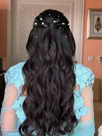 A full back view of the pool party hairstyle, showing the length and texture of the waves.