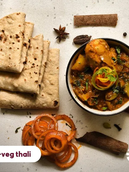 For my friends who love non-veg, I have special options for you too! This is a look at my non-veg thali, featuring a delicious home-style chicken curry alongside all the regular accompaniments. It’s a hearty meal that will surely make your day.