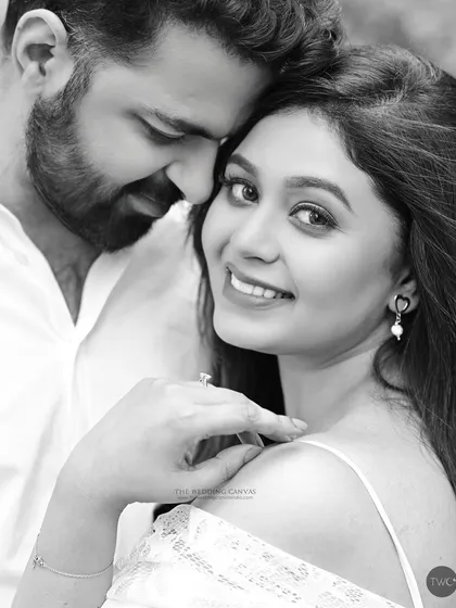 A beautiful moment from an engagement shoot, captured in timeless black and white. Her joyful expression and his gentle touch create a portrait filled with warmth and affection.