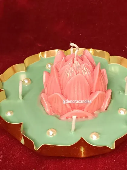A three-quarter view of the pink lotus urli candle, emphasizing its handcrafted details.