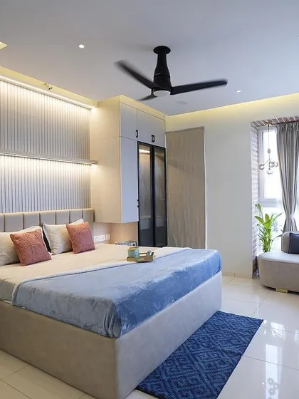 This master bedroom is a sanctuary of comfort and style. I designed it with custom wardrobes, a serene color palette, and a cozy curved window seat, creating a perfect retreat for rest and relaxation.