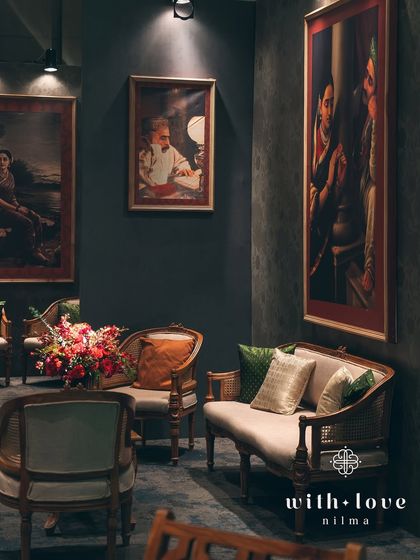 An intimate lounge corner, perfect for quiet conversations amidst the celebration. The decor is rich and layered, creating a warm and inviting atmosphere.