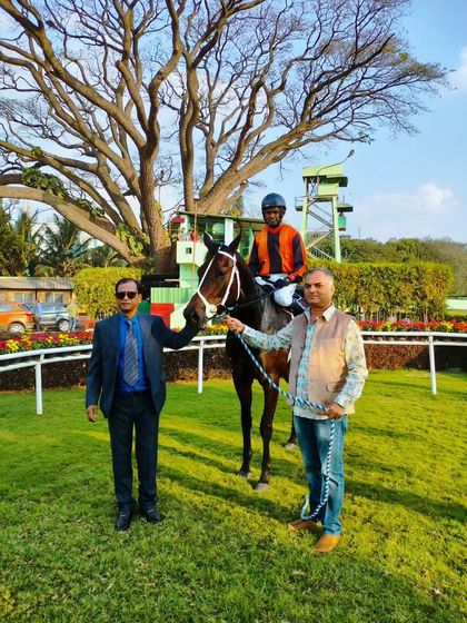 Excellent Lass, with jockey Neeraj Rawal, after winning the million-rupee race.