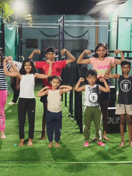 Our kids' crew showing off their hard-earned muscles. We build confidence and strength in a fun, group environment.