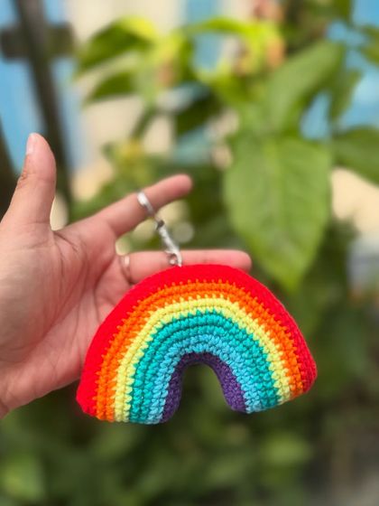 Add a little color to your life with our rainbow keychain. It's a bright and happy accessory for your keys or bag.