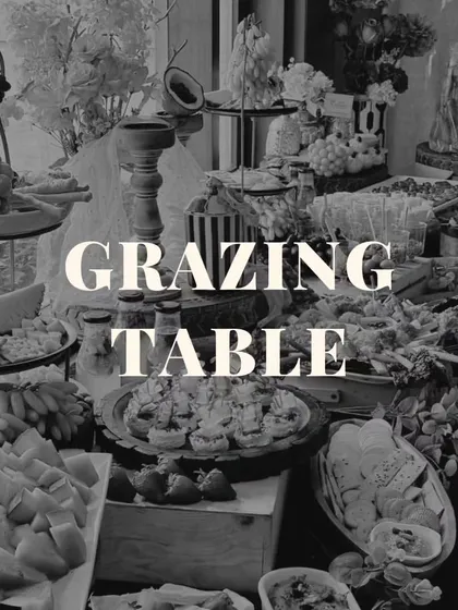 Even in black and white, the beauty and abundance of our grazing tables shine through. This image highlights the rich textures and intricate arrangement of our edible art.