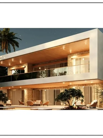 The same architectural marvel viewed at night. The strategic lighting highlights the clean lines of the structure and illuminates the outdoor living spaces, creating a dramatic and inviting scene.