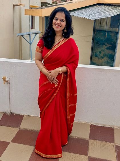 My client looking radiant and festive in the red pure Mysore crepe saree. It's a perfect choice for celebrations.