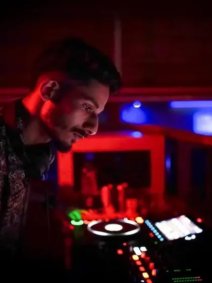 In the zone, crafting the perfect set. This is a look at the focus and precision that goes into mixing and producing music. Every beat, transition, and drop is carefully considered to build energy.