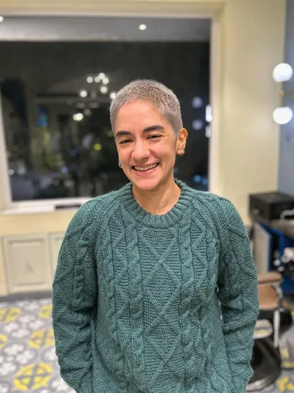 The same client, smiling and confident with her new short hairstyle. My goal is always to make you leave feeling amazing in your new look.