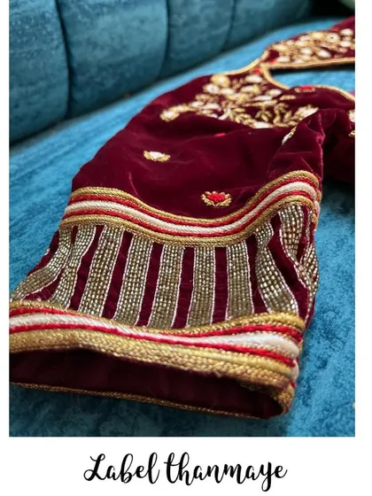 This is a close-up of the sleeve detail on a rich maroon velvet blouse. I used intricate beadwork and zardozi embroidery to create a heavy, luxurious look for a wedding.
