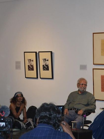A close-up of Gulammohammed Sheikh and Pushpamala N during their conversation.