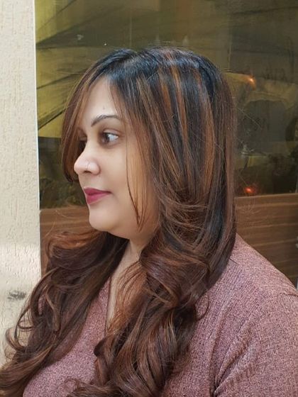 A profile view of the finished style. The combination of expert colouring and styling results in a look that is both elegant and modern.