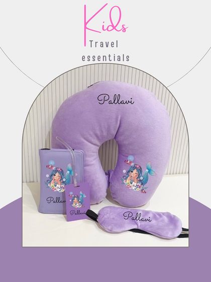 A dreamy mermaid-themed travel set for your little one. The purple set includes a neck pillow, eye mask, passport cover, and luggage tag, all personalised.