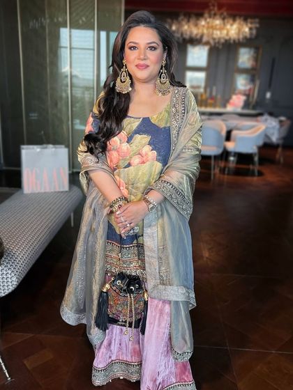 A stunning client in a Sabyasachi outfit, her soft glam makeup featuring a flawless base and subtle shimmer.