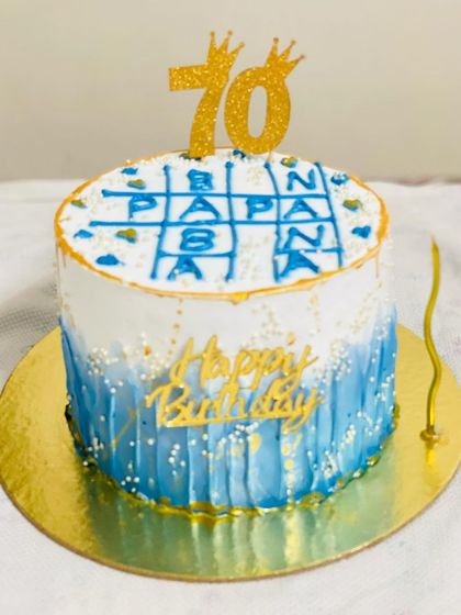A special 70th birthday cake with a crossword puzzle design for a beloved grandfather.
