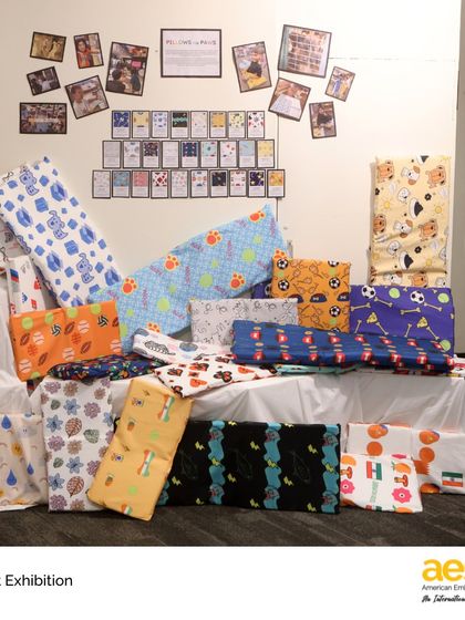 A colorful display of pillows created by middle school students. Our arts program includes practical design and textile projects, allowing students to create functional and beautiful items.