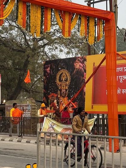 A street scene in Ayodhya, with banners and cutouts of Lord Ram lining the roads. This photo captures the everyday life of the city during a period of immense celebration.