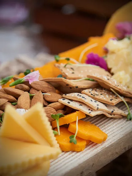 A close up of a grazing board from our award winning corporate event in Agra. The combination of textures and flavours from the cheeses, nuts, and crackers was a highlight for guests.
