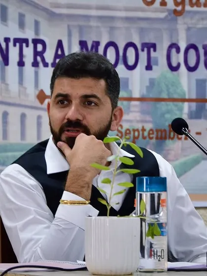 Here I am, deeply focused while judging an Intra Moot Court Competition. It's in these moments, assessing arguments and providing feedback, that I help shape the next generation of litigators. Practical skills are built through practice and expert guidance.