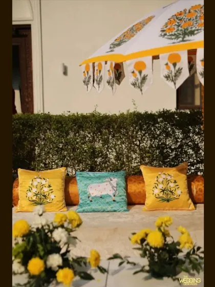 Custom-designed cushions that match the block-print umbrellas, showing our commitment to creating a cohesive look down to the smallest detail.