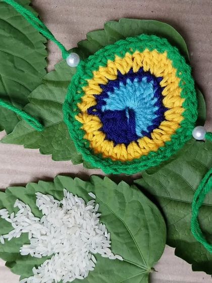 Inspired by the beauty of a peacock feather, this peacock rakhi is one of my more intricate and colorful designs.