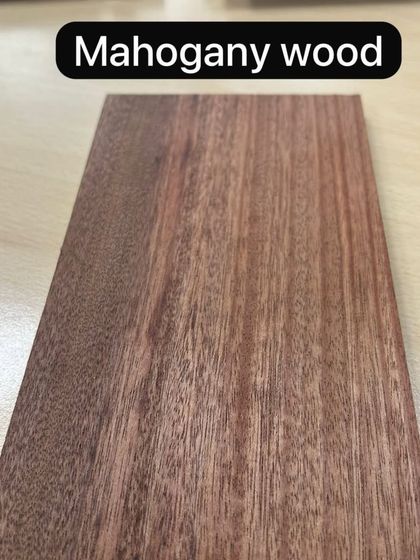 A sample of rich, red Mahogany wood. Known for its beauty and durability, it's a premium choice for high-end flooring, furniture, and cladding.