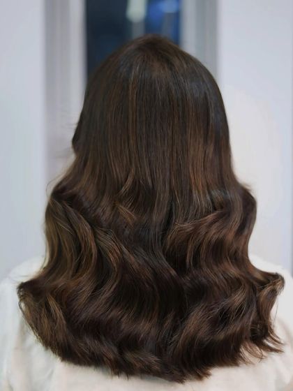 A classic example of our brunette color work, where simplicity meets sophistication. The hair is healthy, shiny, and rich in color.