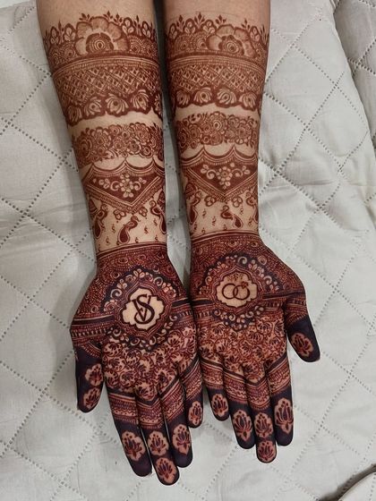 The beautiful result of a bridal mehendi, showing the rich, dark stain after the henna paste has been removed.