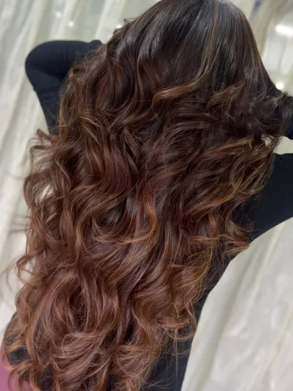 A back view showing the full extent of her gorgeous brown waves. The subtle highlights give the colour a beautiful, natural-looking texture.