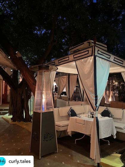 A private cabana with an outdoor heater, ensuring comfort for our guests dining alfresco on a chilly Delhi evening.