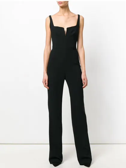 For a sleek and modern alternative to a dress, I design custom jumpsuits. This black crepe couture jumpsuit features a unique cut-out detail at the neckline and a straight-leg cut for a long, lean look.