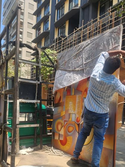 The final step: loading the artwork for delivery. Seeing a large commission like this safely on its way to a client's home or office is the culmination of weeks of creative work and collaboration.