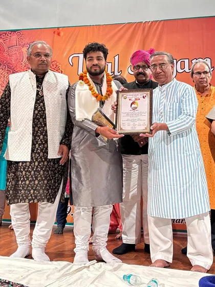 Posing with the award and certificate. A moment of immense gratitude.