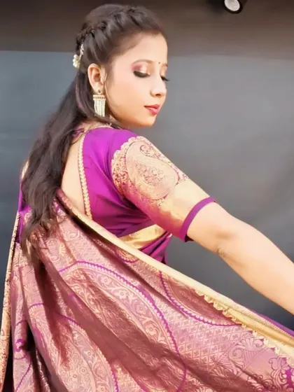 A simple yet elegant look for a family function or festival. The focus is on clean skin, a simple hairstyle, and a beautiful saree.